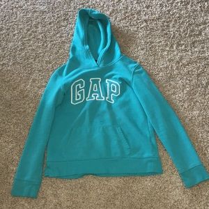 A turquoise Gap sweatshirt